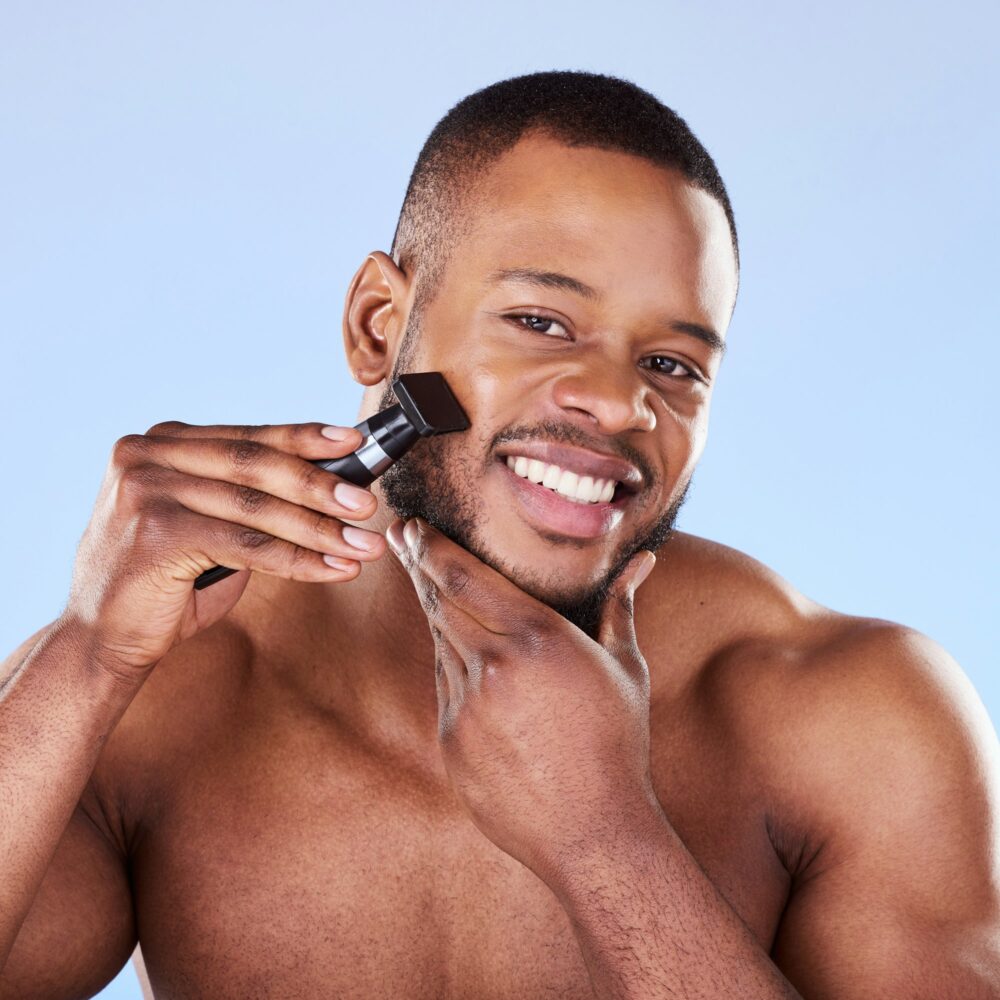 Portrait, man and shave with razor for hair removal, aesthetic skincare and facial cleaning in stud